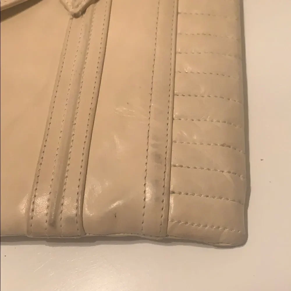Reece Hudson cream colored clutch‎